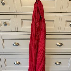 Red neck scarf with fringe detail.